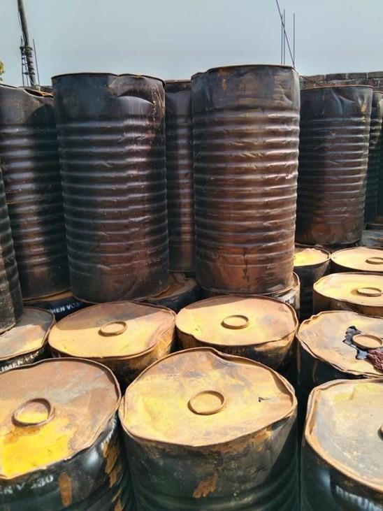 Stacked bitumen drums at the Lakshamii Traders godown